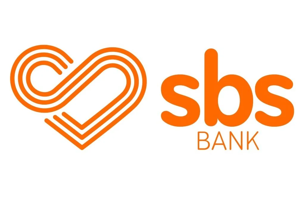 A logo featuring an abstract orange heart shape made of multiple lines, accompanied by the text 'sbs BANK' in orange, with 'sbs' in bold lowercase and 'BANK' in smaller uppercase letters underneath.