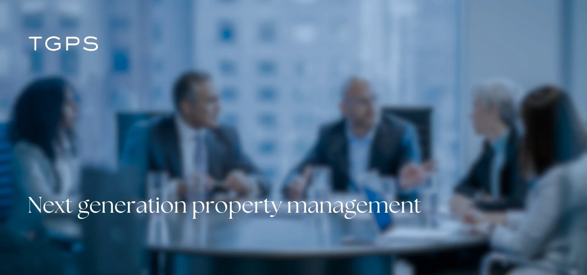 A blurred image of a business meeting with five people sitting around a conference table, with the text 'TGPS' and 'Next generation property management' overlaid.