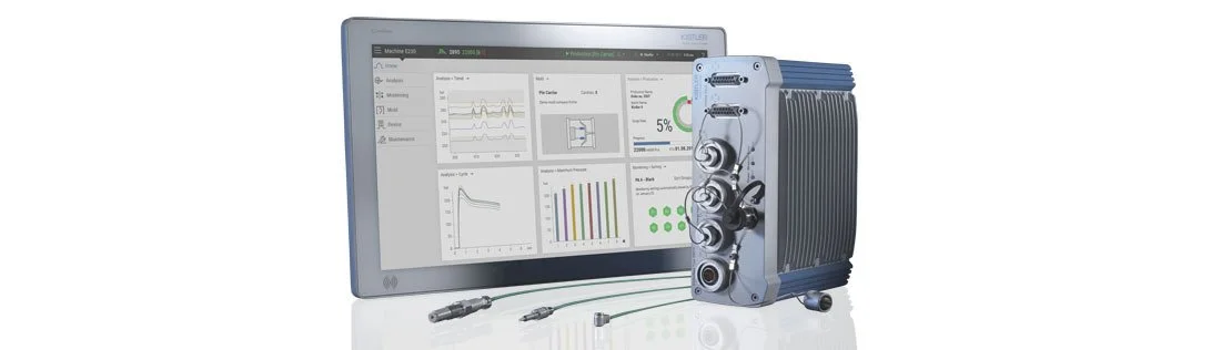 Medical or scientific equipment connected to a screen displaying data charts and graphs.