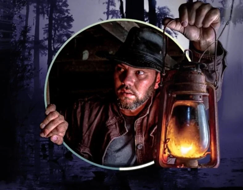 Graphic of RattleSnake Dre exploring South Louisiana, holding a lantern looking for undiscovered treasures through history.