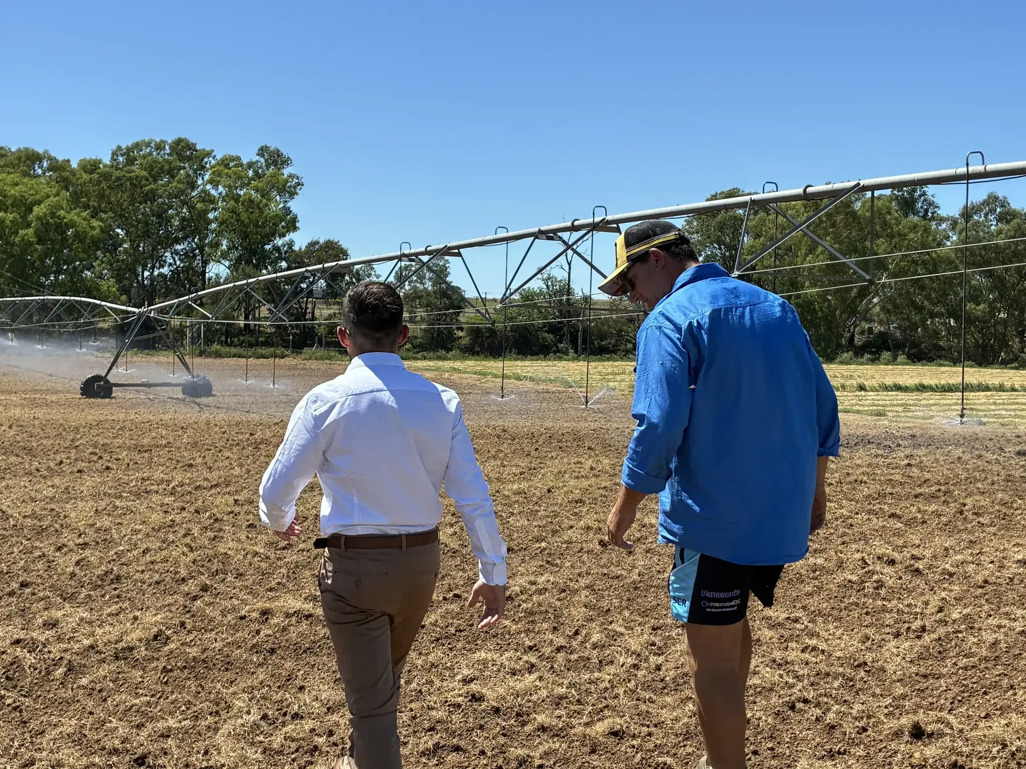 rob discussing domestic and stock water requirements with a client in a paddock