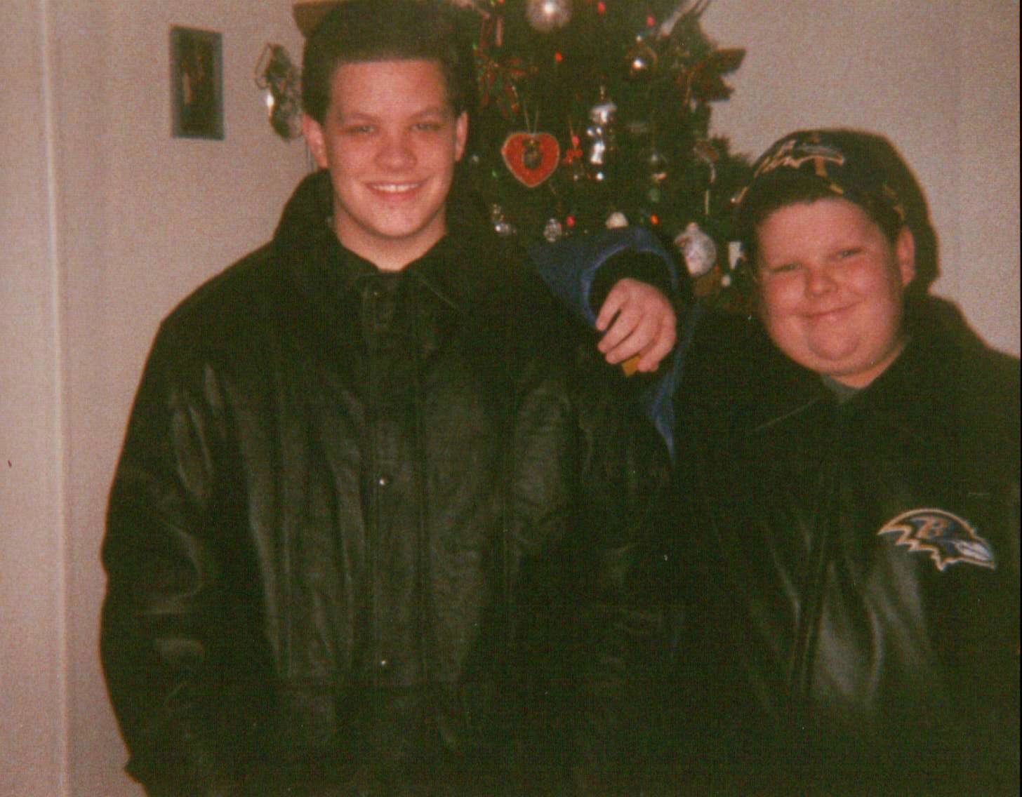 Me and my brother, Kevin in front of our Christmas tree.