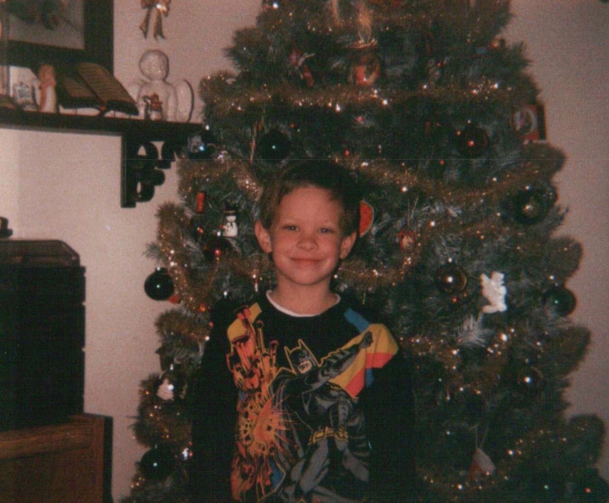 Me in front of our Christmas tree.