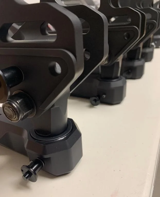 An assembly line of mounts and weapons.