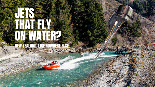 An image of a jet boat being powered across a river by a stream of water from a giant tap coming out of a mountain.