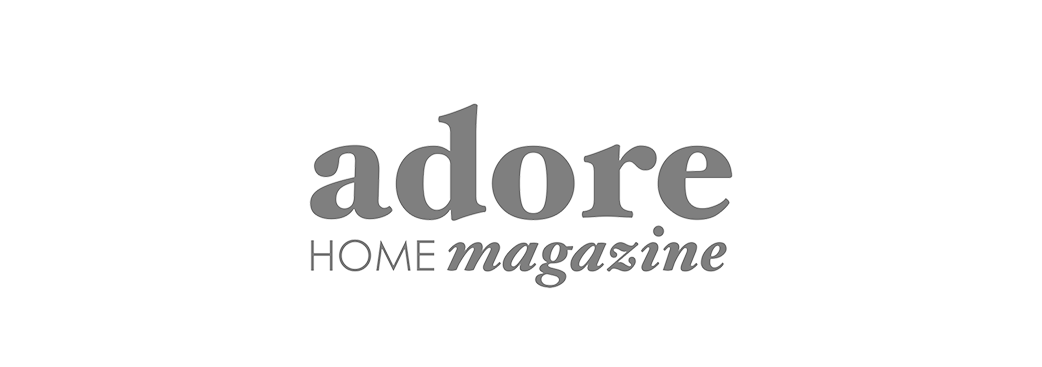 Logo for Adore Home Magazine in black and gray text.