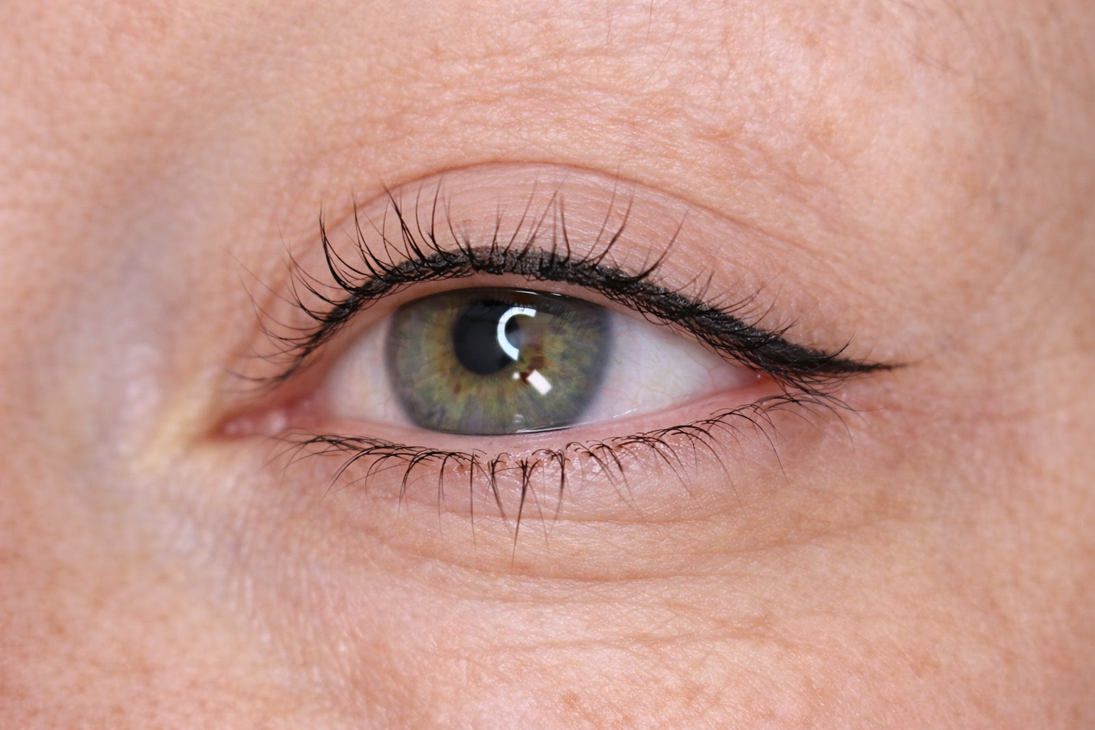 Classic winged eyeliner permanent makeup creating a soft, natural enhancement in Lynchburg, Virginia.