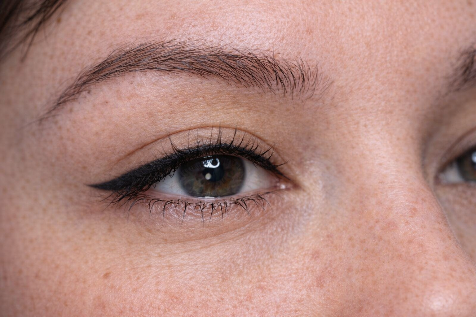 Classic winged eyeliner permanent makeup creating a soft, natural enhancement in Lynchburg, Virginia.