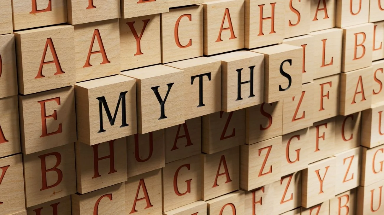A photo of blocks with black letters spelling out "myths" surrounded by blocks with random red letters.