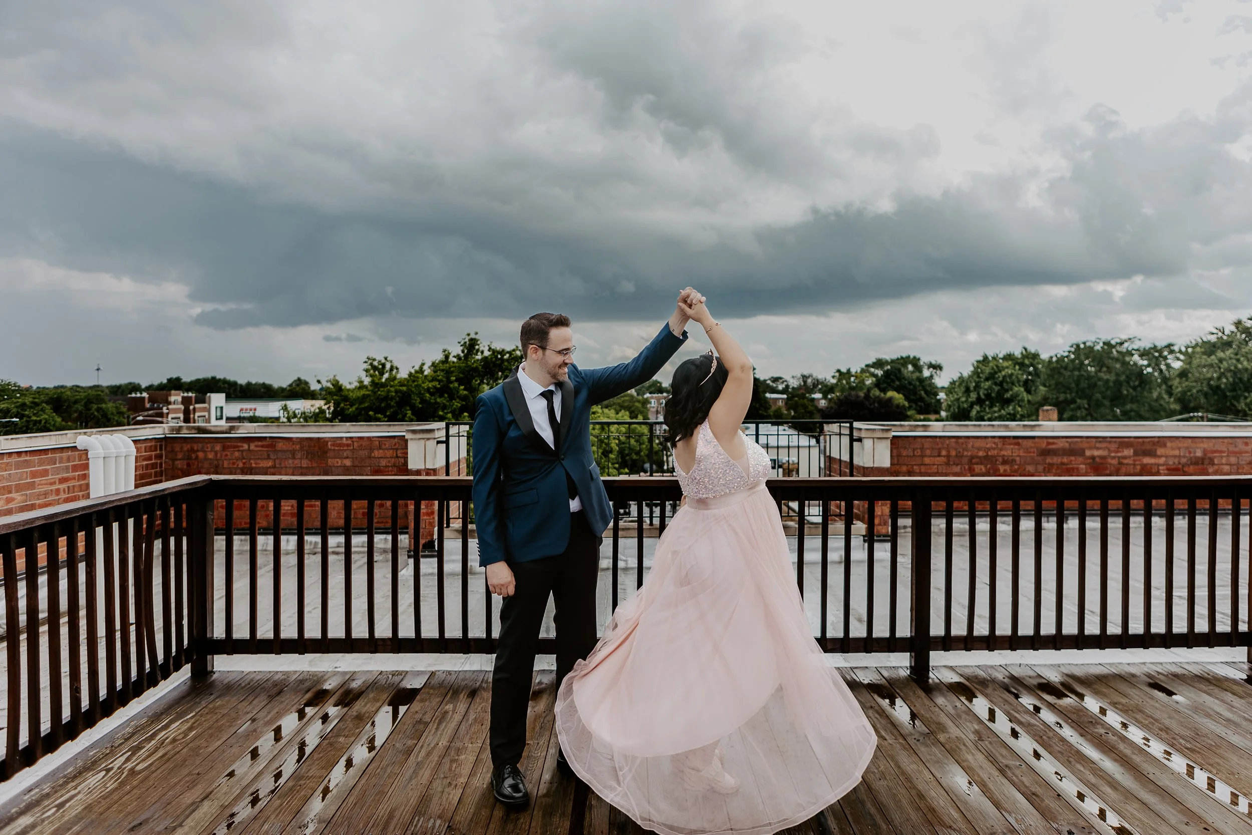 A couple dancing on a rooftop terrace