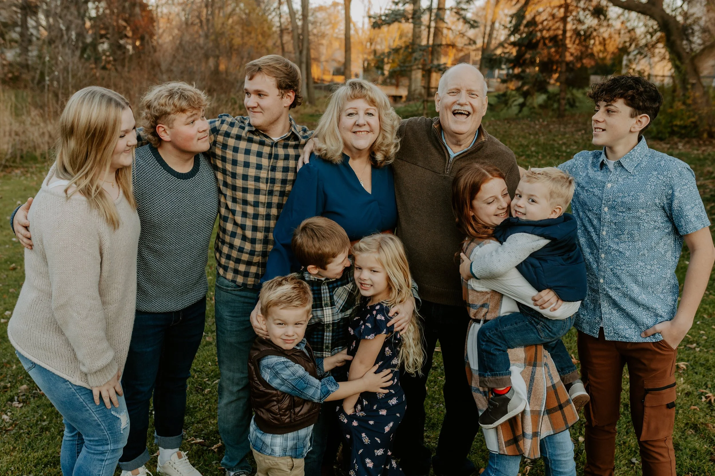 Kids gathered around their grandparents laughing and smiling