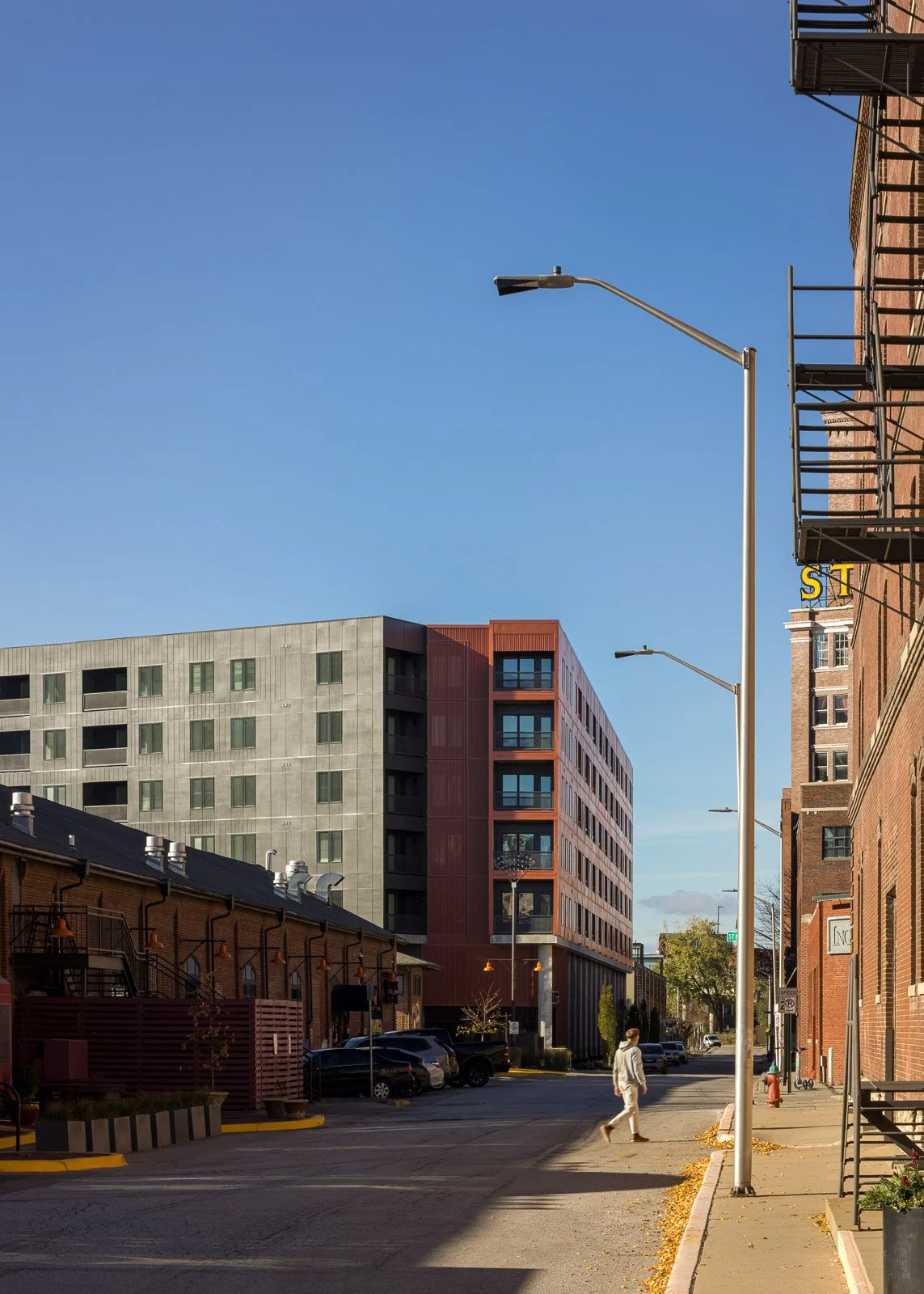 Wide exterior view of building entry and site context captured in commercial architecture photography.