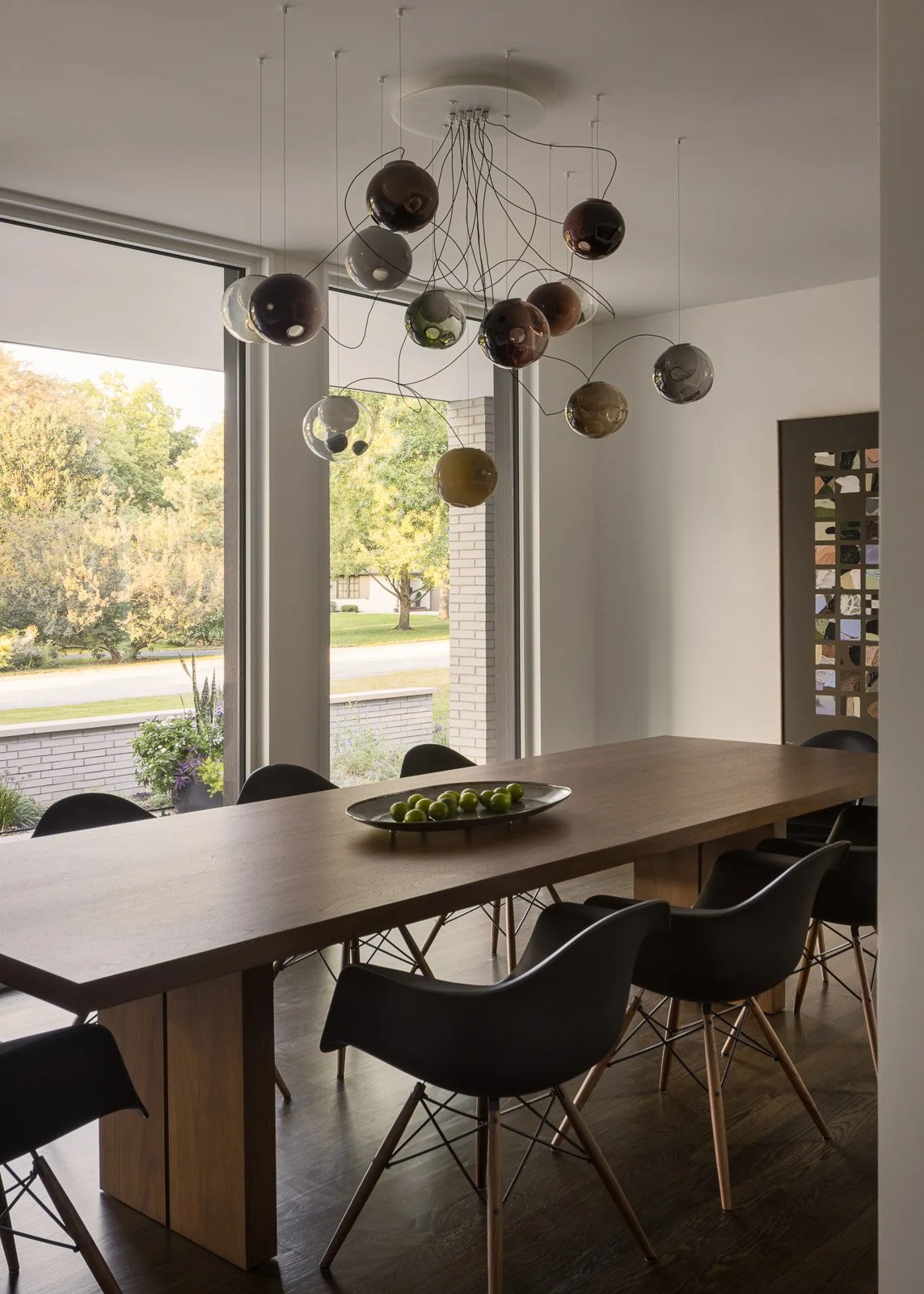 Interior evening view of Prairie Light residence with warm lighting and shadow play