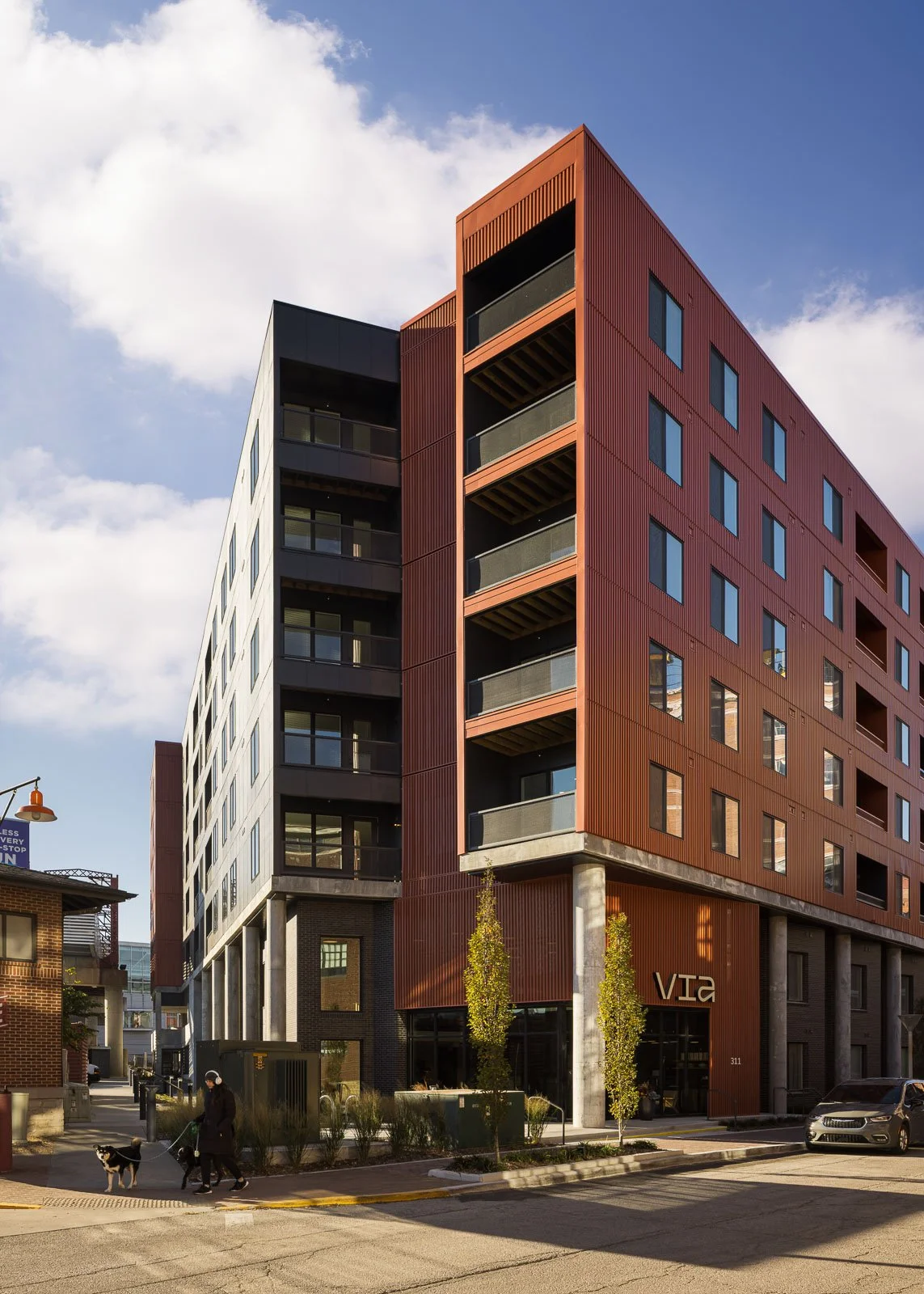 Close-up exterior detail of Tracks façade highlighting texture and commercial architectural design.
