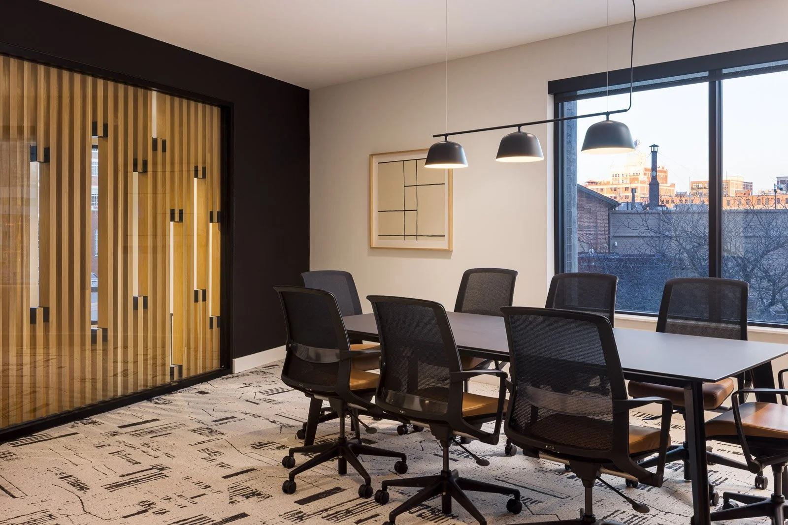 Natural light illuminating interior spaces, showcasing materiality and form in architectural photography.