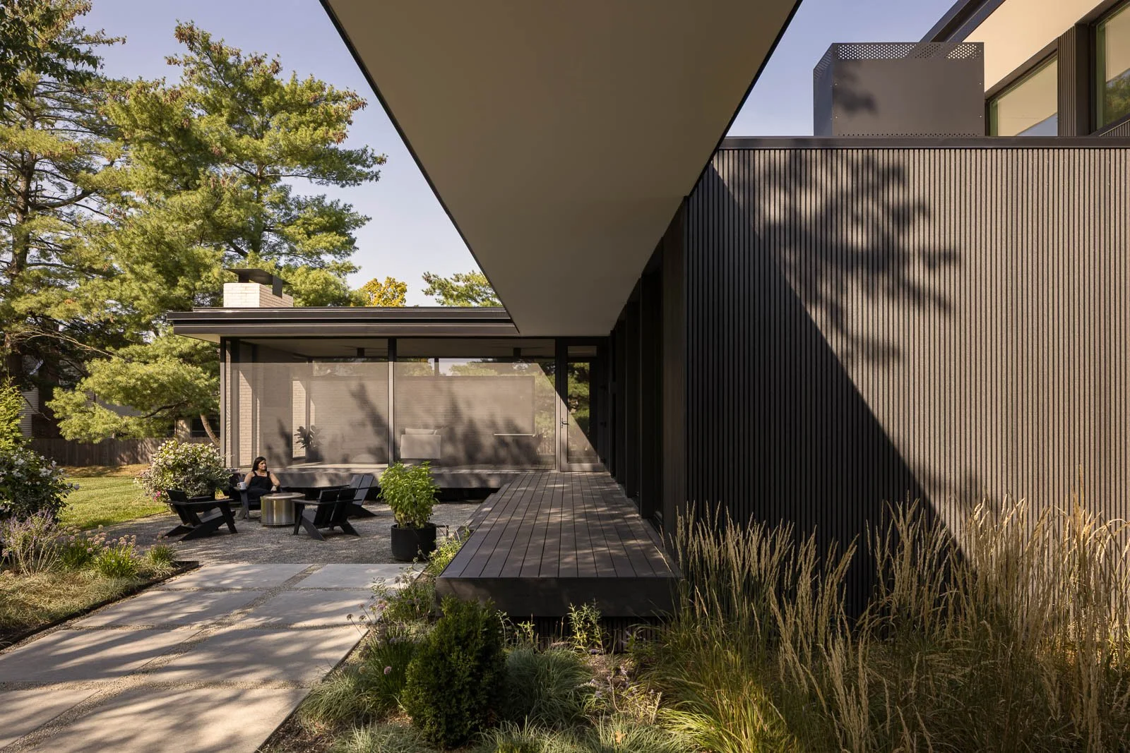 Exterior rear view of Prairie Light showing modern design, outdoor spaces, and light-filled façade