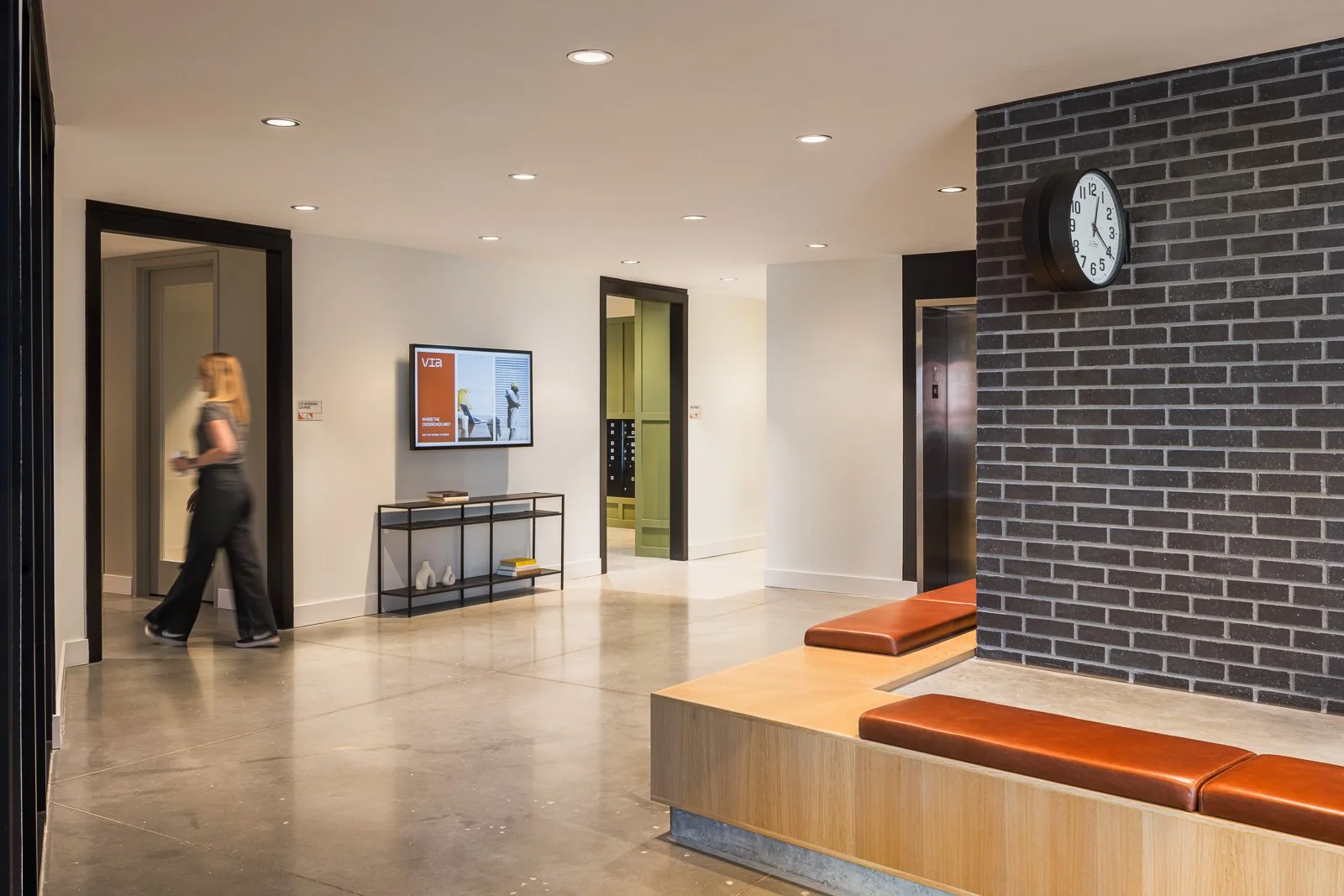 Interior shot emphasizing layered volumes and depth in Tracks commercial space.