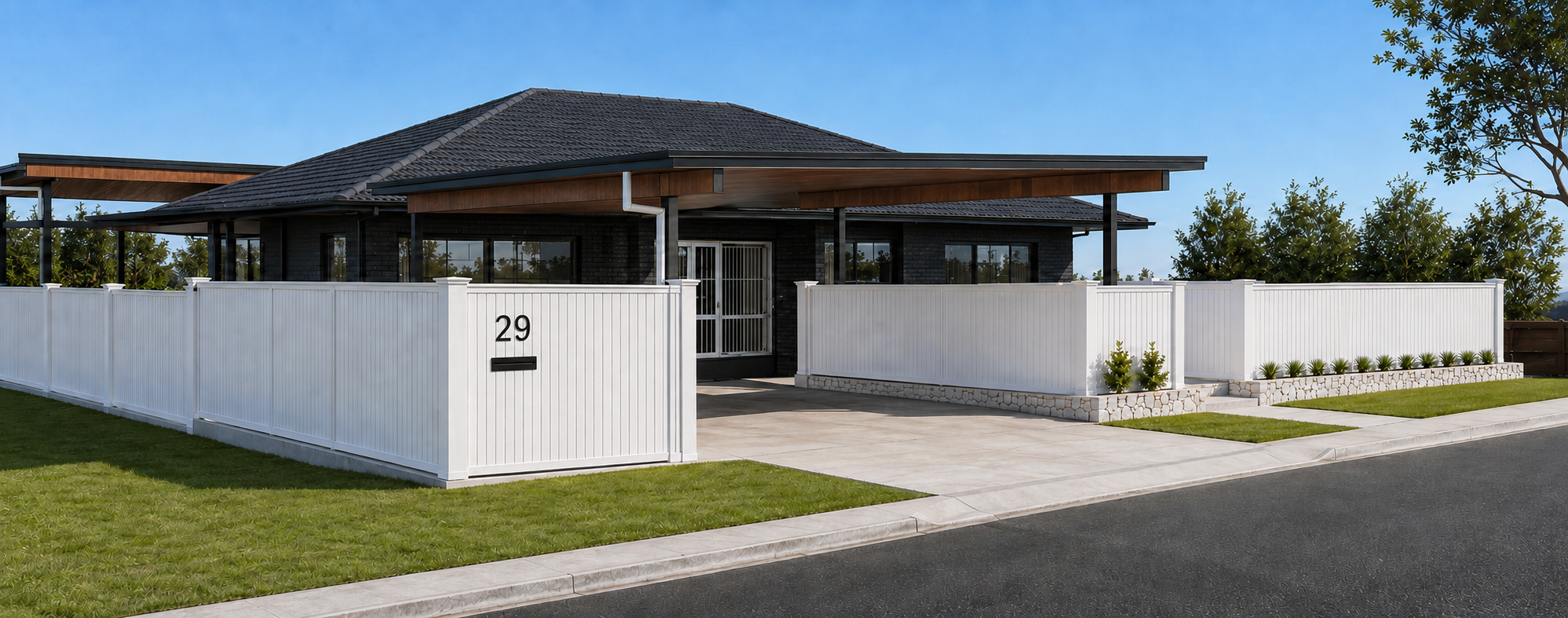 Modern house with black exterior, gray roof, white fence, and landscaped yard, number 29 on the gate.