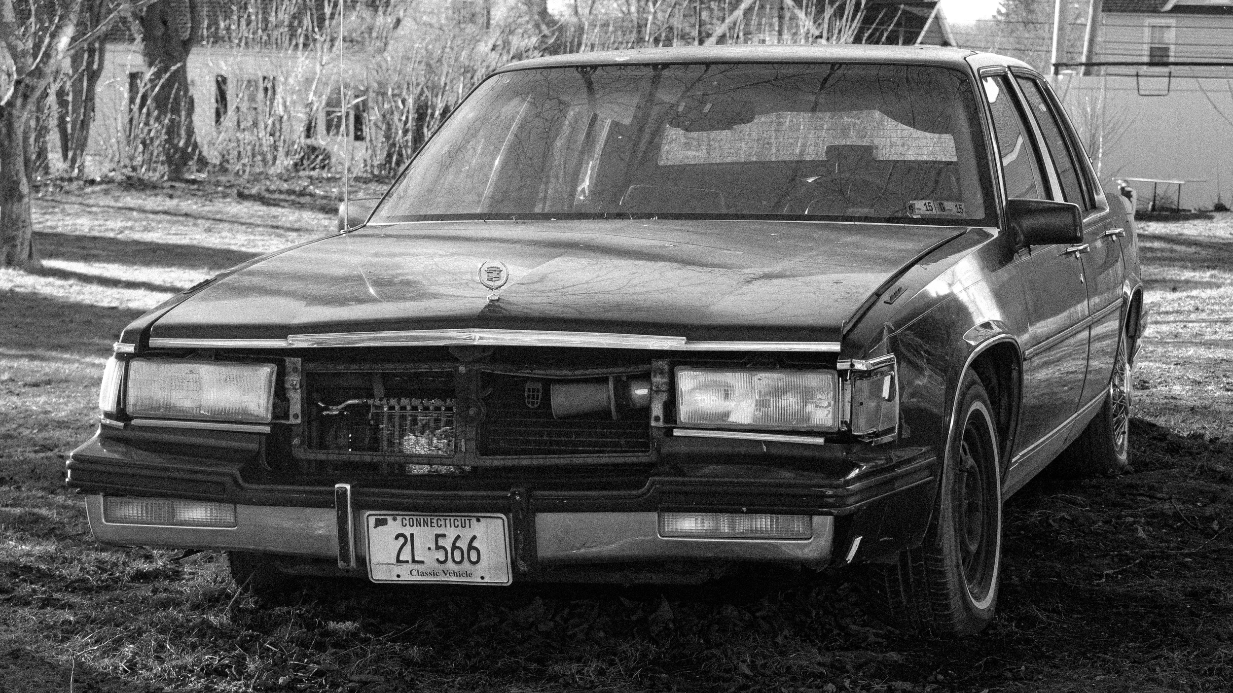 A black and white photo of a car taken on a walk