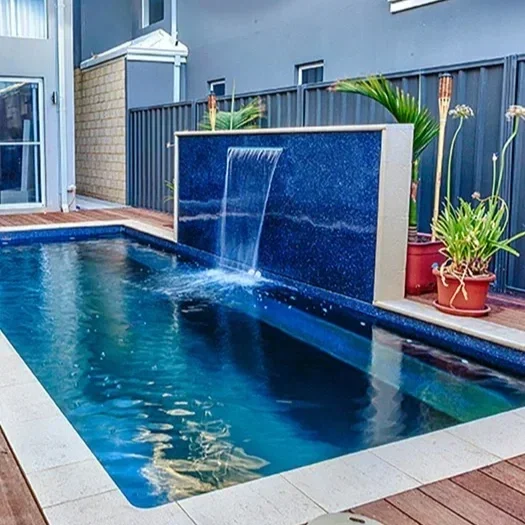 Freedom Pools Entertainer fibreglass pool with water wall feature and timber decking - available through Plungeit Pools Queensland