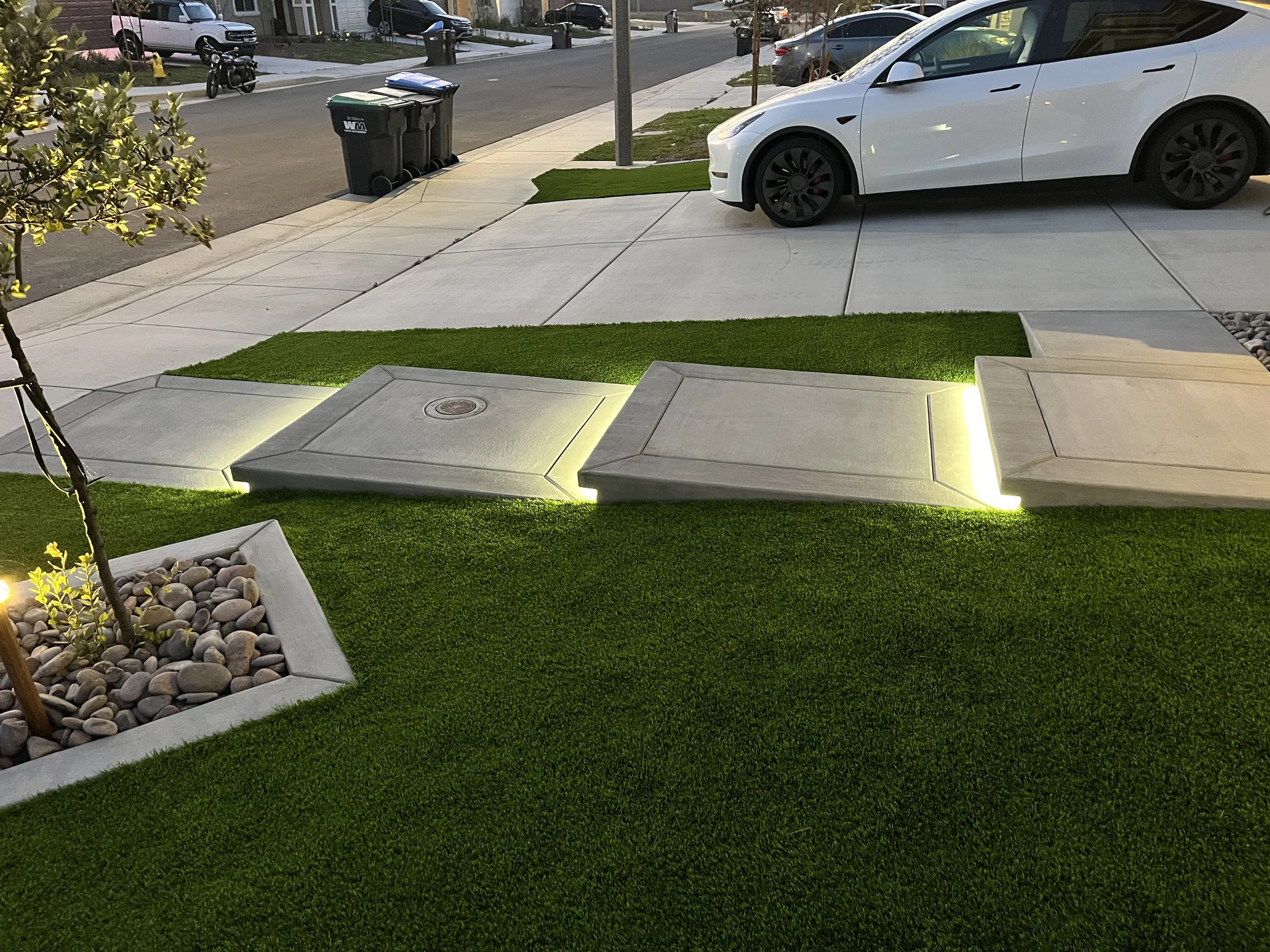 Residential concrete walkway and turf landscape remodel completed in Murrieta, California, with a focus on curb appeal and functionality.