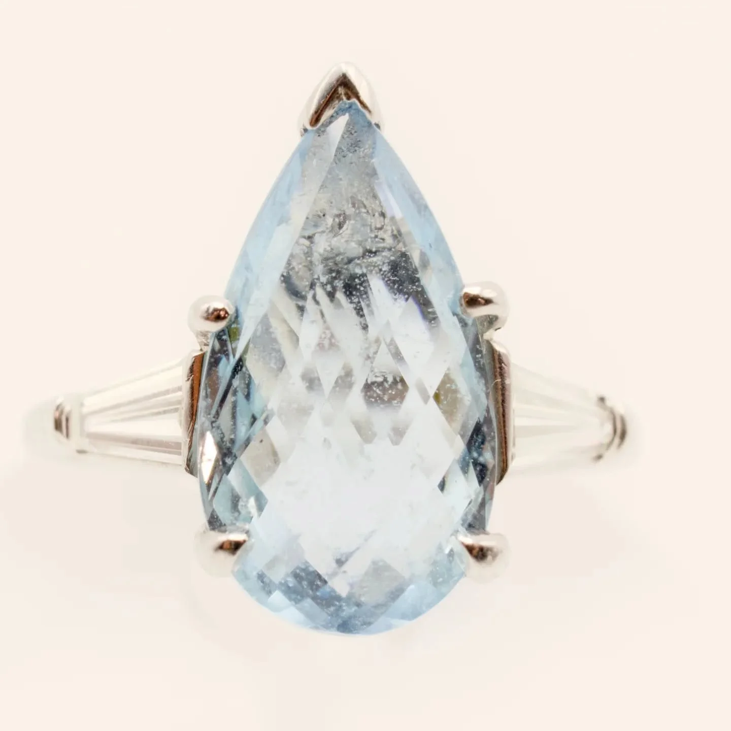 Summer in a ring.

Pear-shaped Aquamarine with modified baguette-cut shoulders. 

Check it out at Jean Alexandra.com. Link in bio