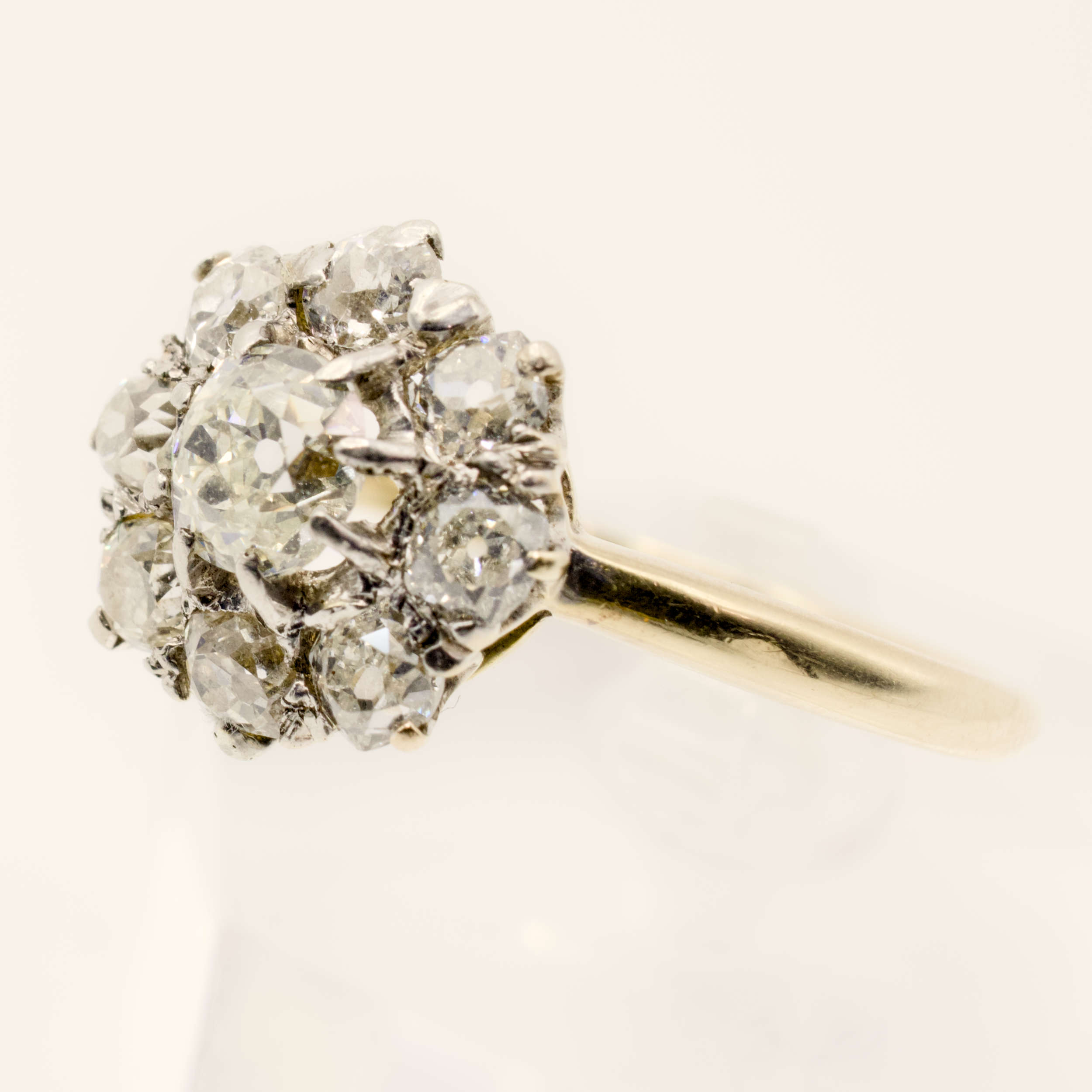 Close-up of a diamond cluster ring in yellow gold