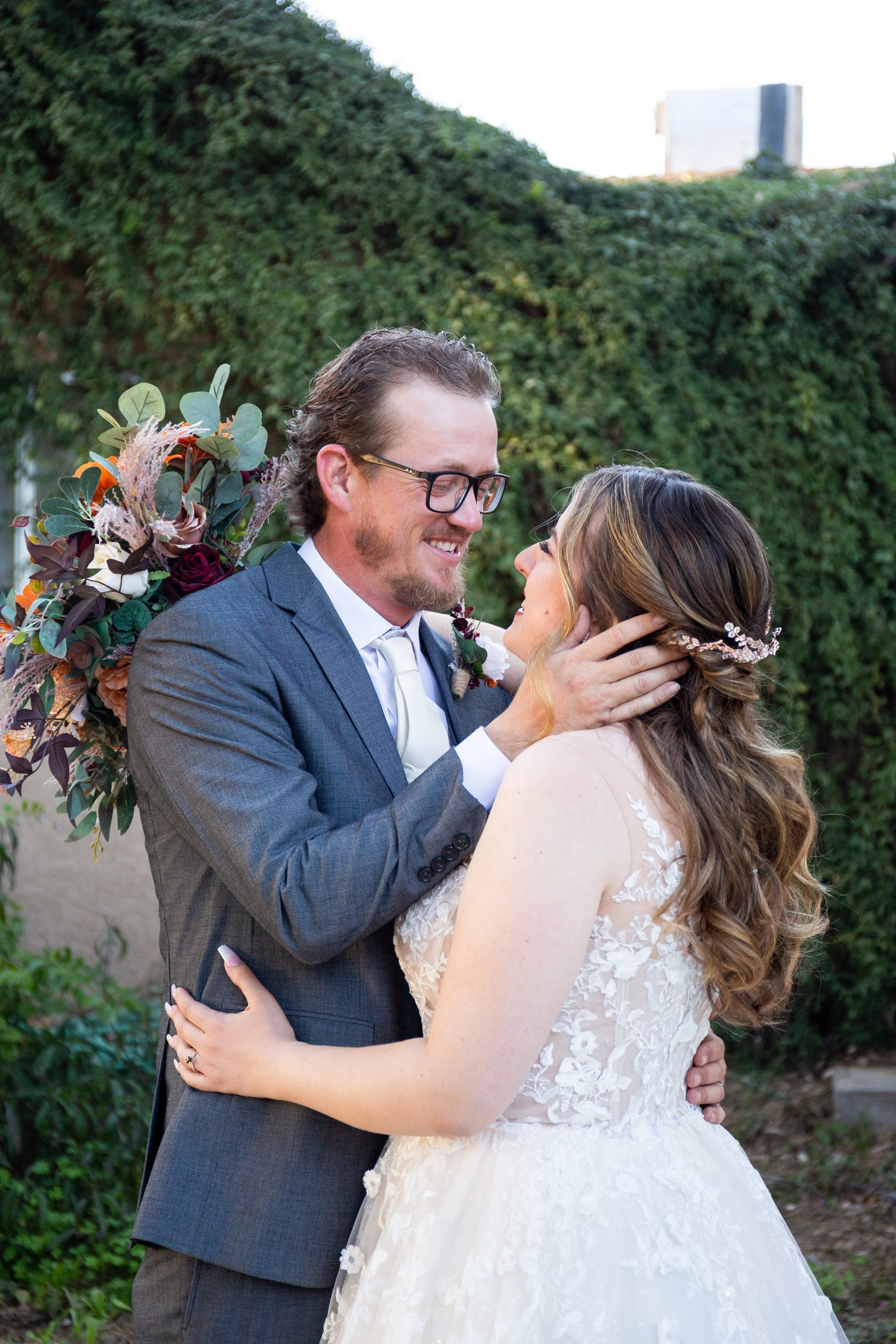 Amelia Thorp Hair & Makeup in Phoenix does a  romantic half up hairstyle on a bride in Phoenix, Arizona. Photo by Deniseana Photography
