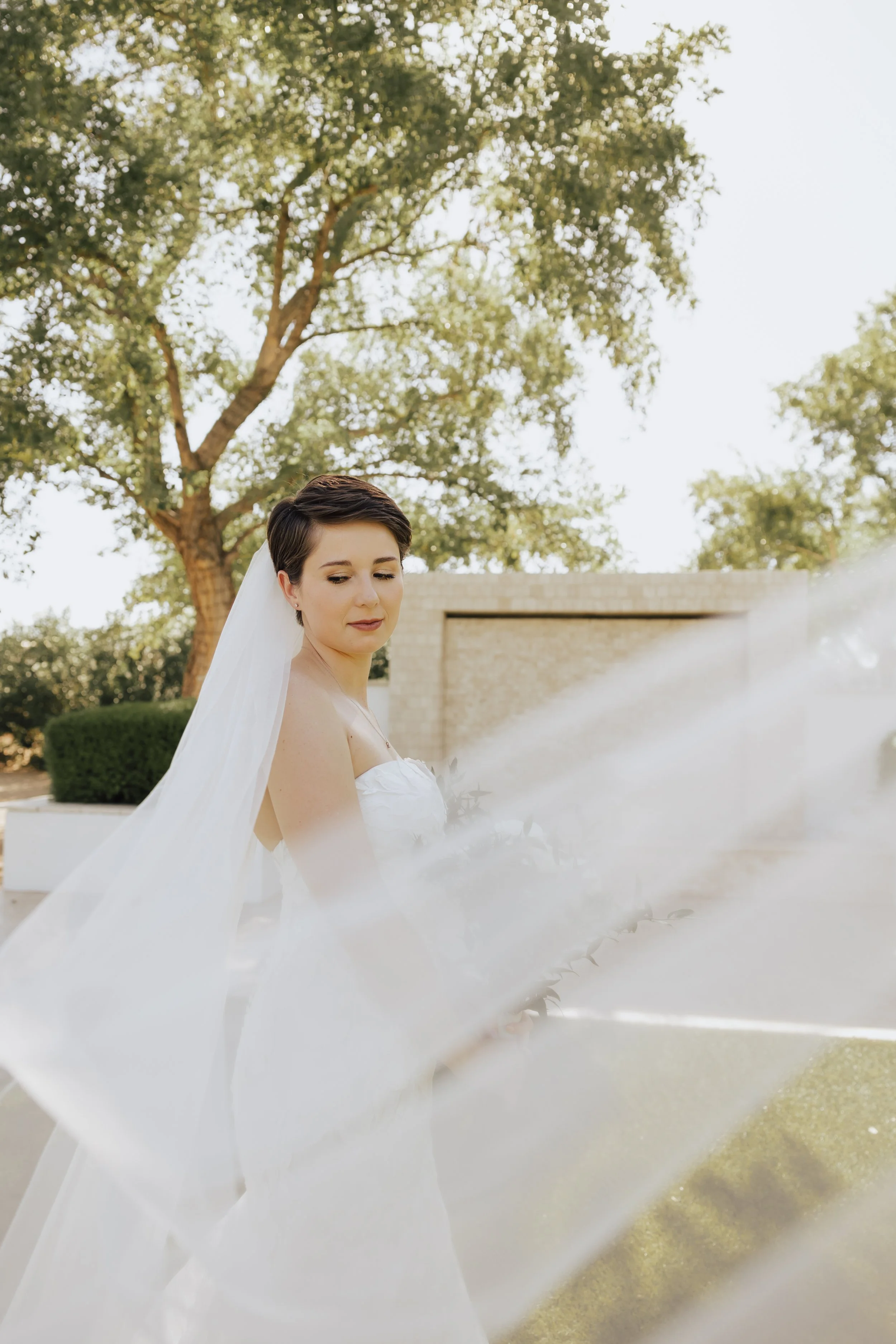 Amelia Thorp Hair & Makeup in Phoenix does a  timeless hair and makeup look for a bride with a pixie cut at Lindsay Grove in Mesa, Arizona. Photo by Emily Albright Photography
