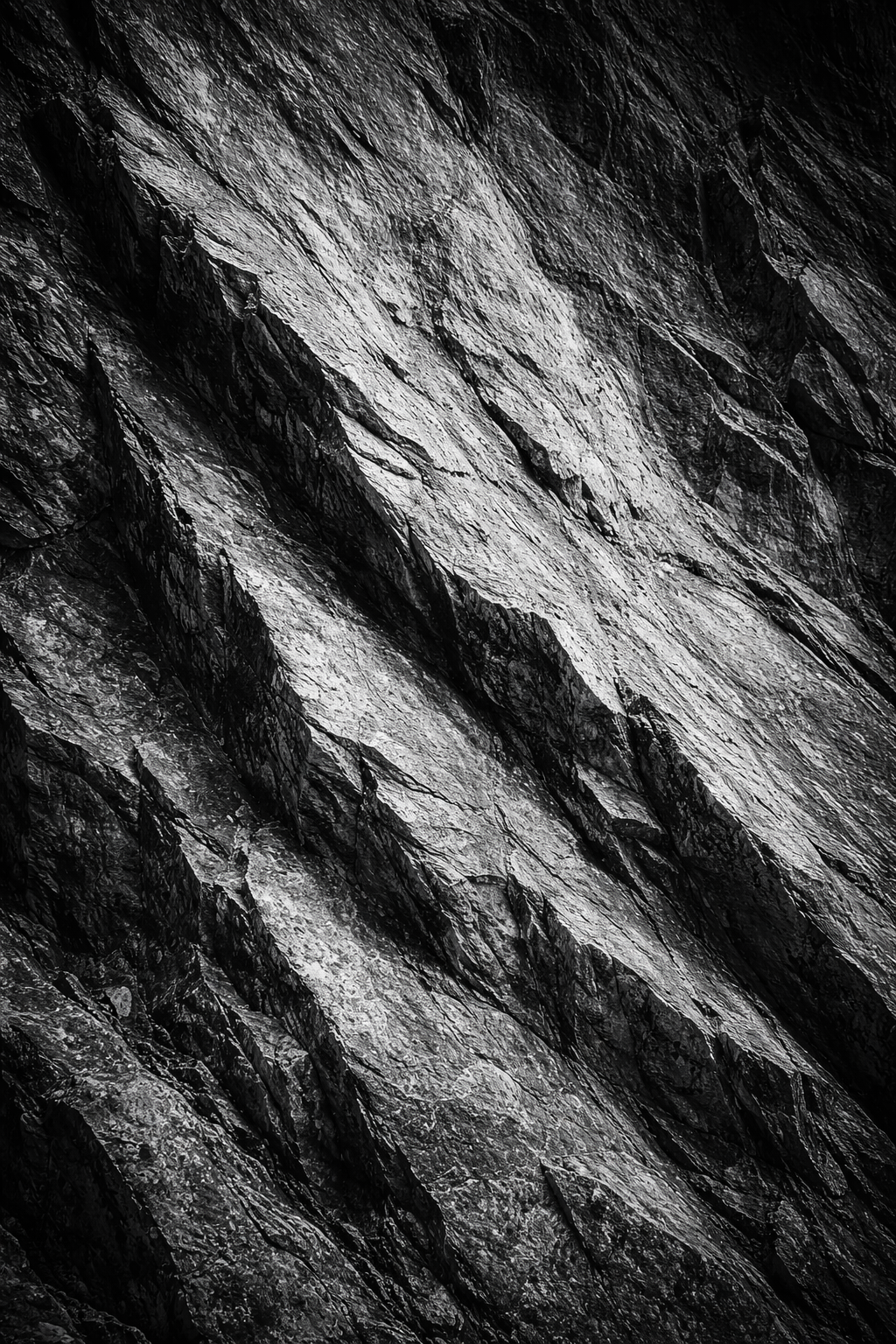 Black and white close-up of alpine rock formation with layered strata
