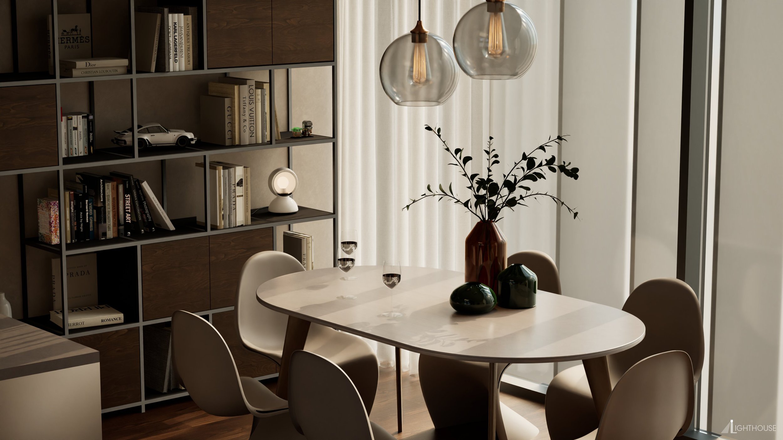 Modern dining area with a white oval table, surrounded by six beige chairs, with a large brown vase with green leaves and colorful decorative objects on the table. Behind, a bookshelf filled with books and decorative items, illuminated by natural lig