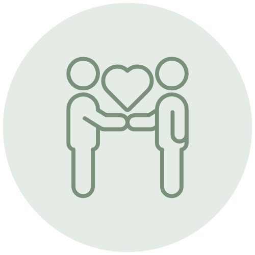Two people holding hands with a heart between them.