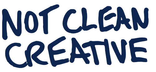 Text saying 'NOT CLEAN CREATIVE' in dark blue, brushstroke-style font.