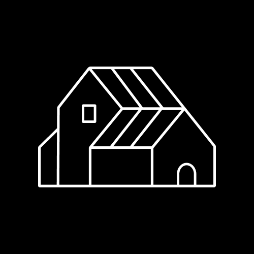 Simple line drawing of a barn or farm building with a gabled roof, small window, door, and additional structure attached on the side, on a black background.