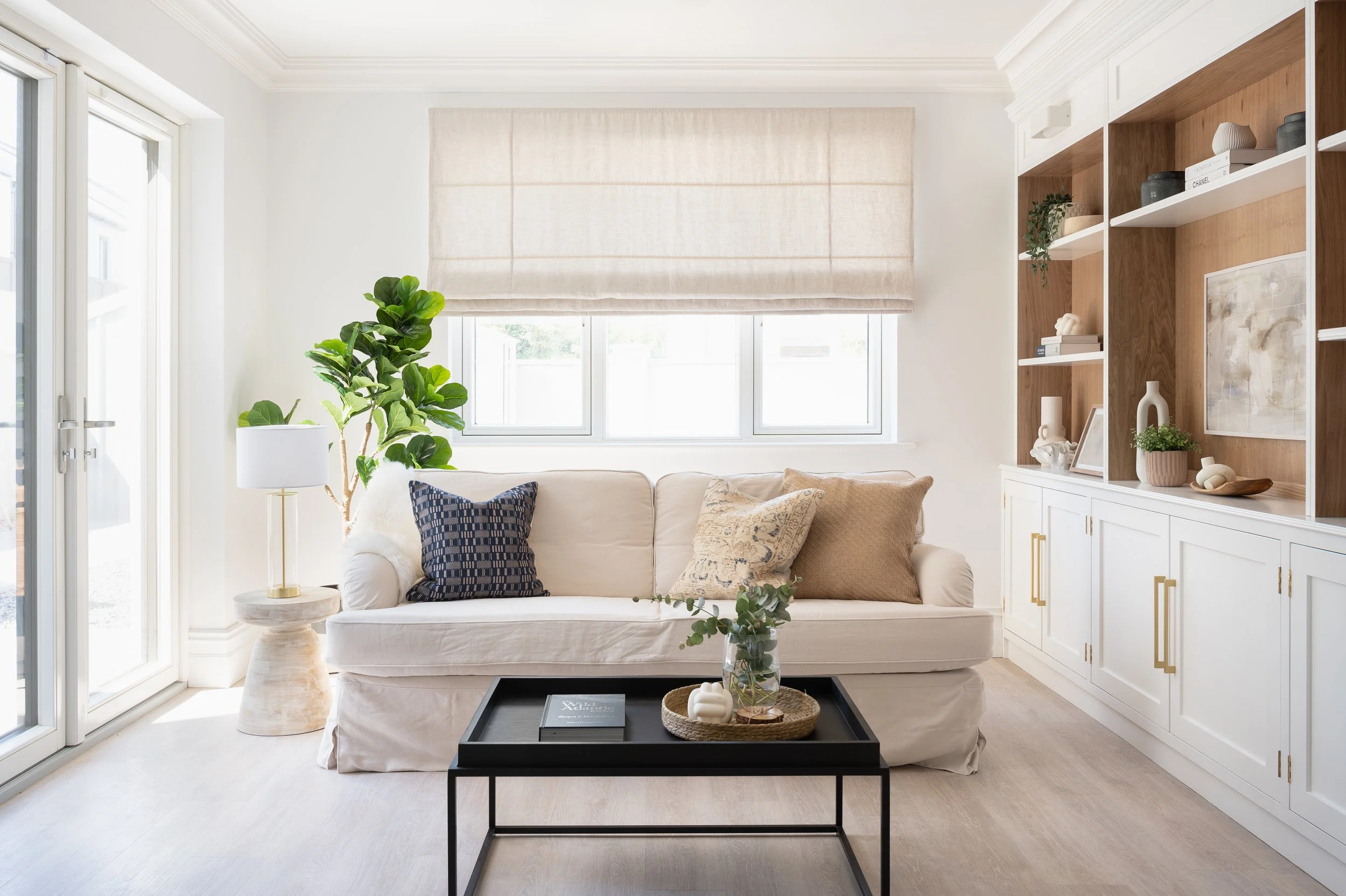 Completed Killarney Townhouse show home by Aoife Maria Interiors, featuring an open-plan living and dining interior with layered furniture, lighting and finishes.