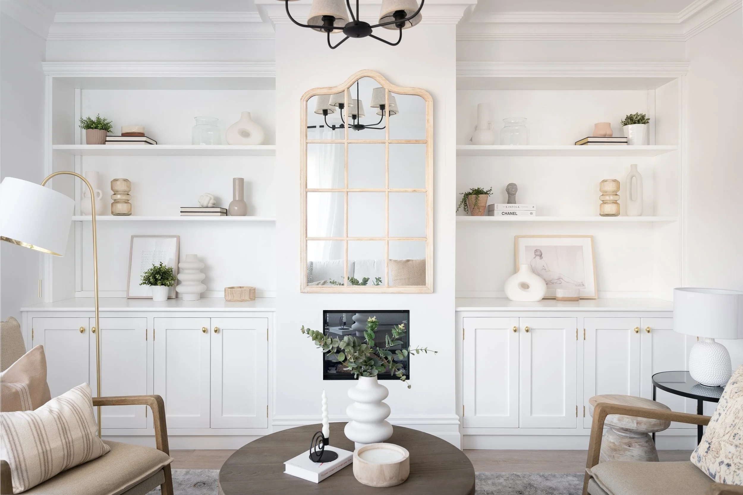 Completed show home living room at Killarney Townhouse by Aoife Maria Interiors, featuring bespoke cabinetry, artwork, furniture and layered styling.