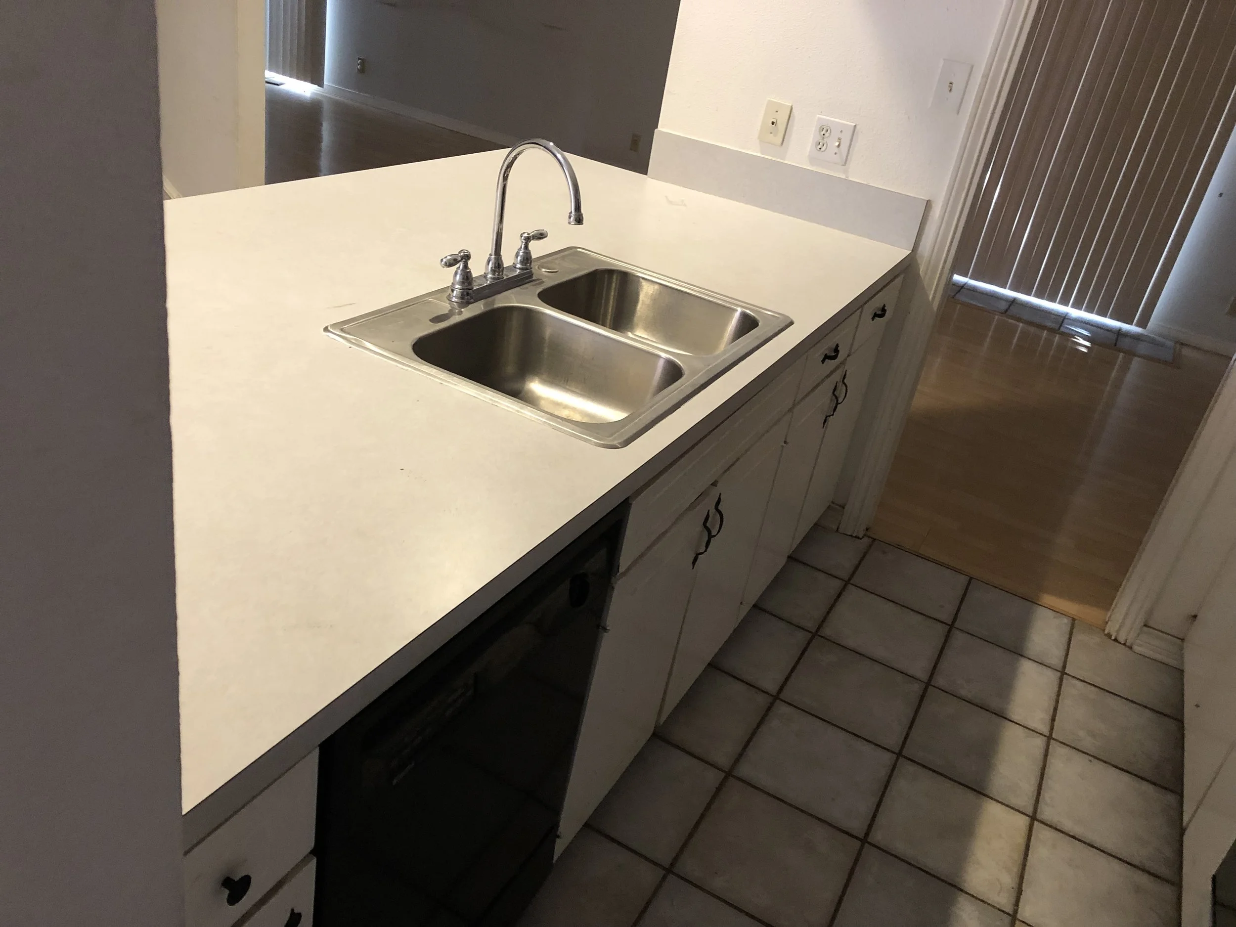 Kitchen: Dated original countertop (Before)