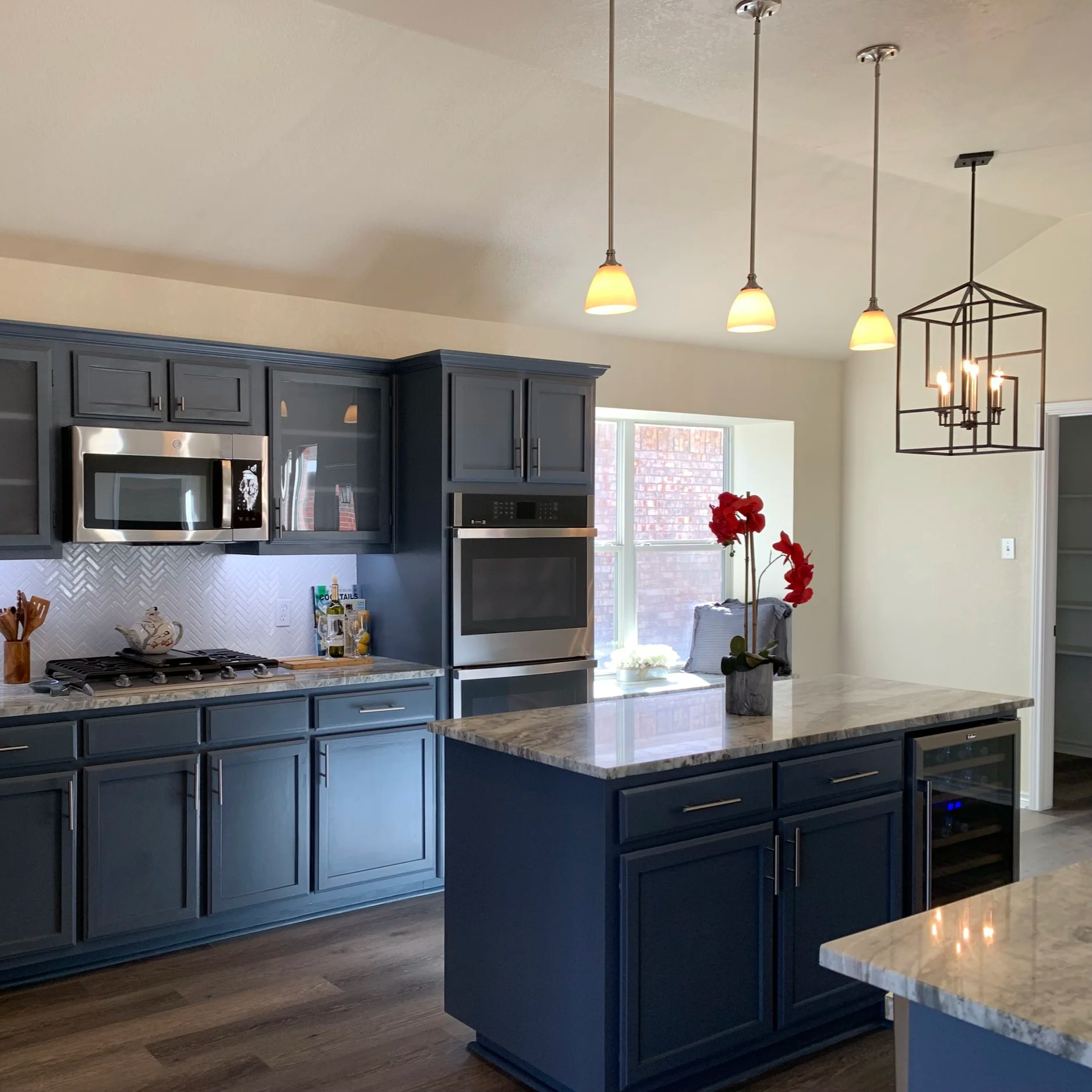 Kitchen: Modernized layout and light-reflective surfaces designed to brighten the entire space