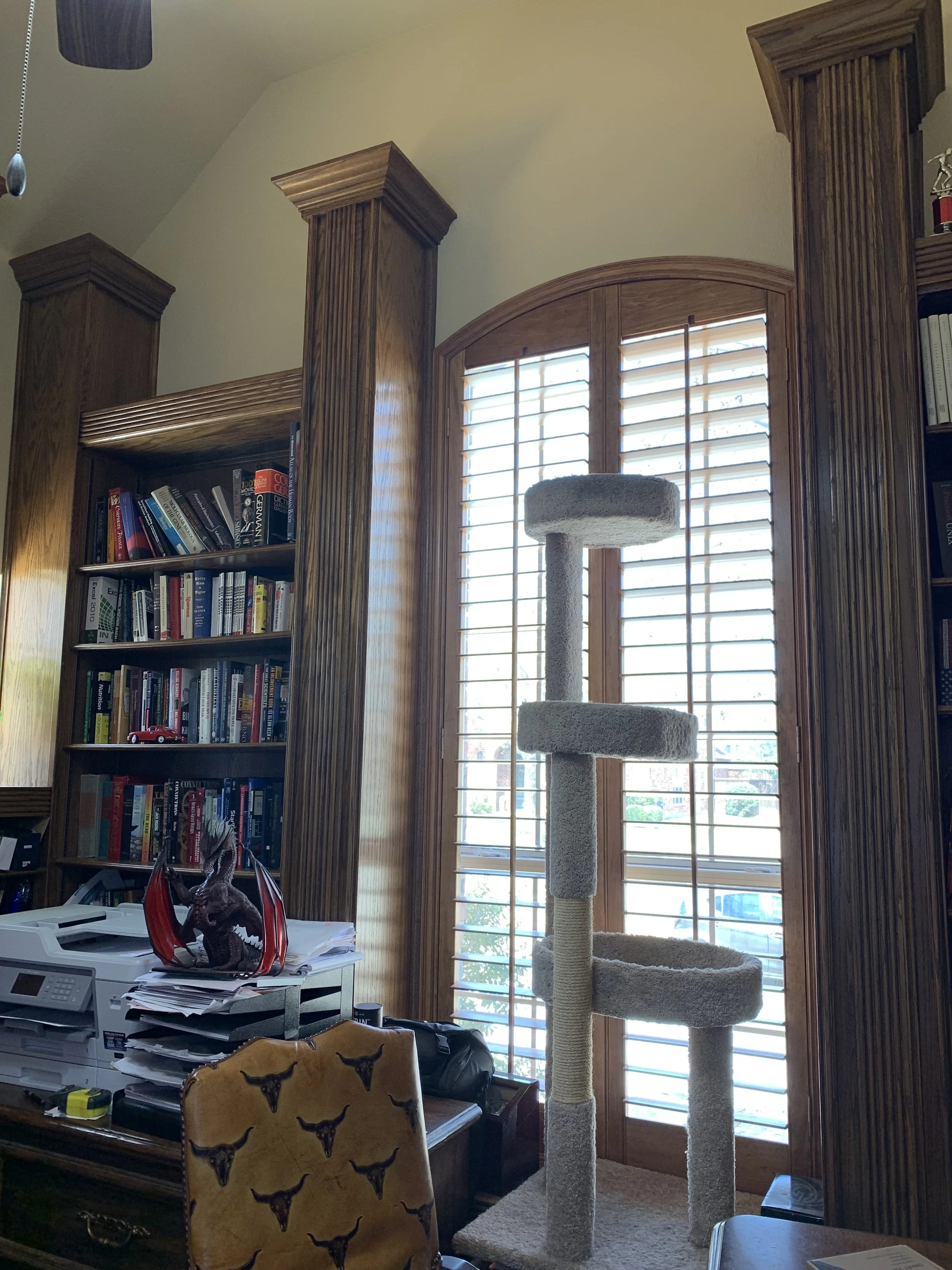 Study: Heavy, floor-to-ceiling paneling dominated the room (Before)