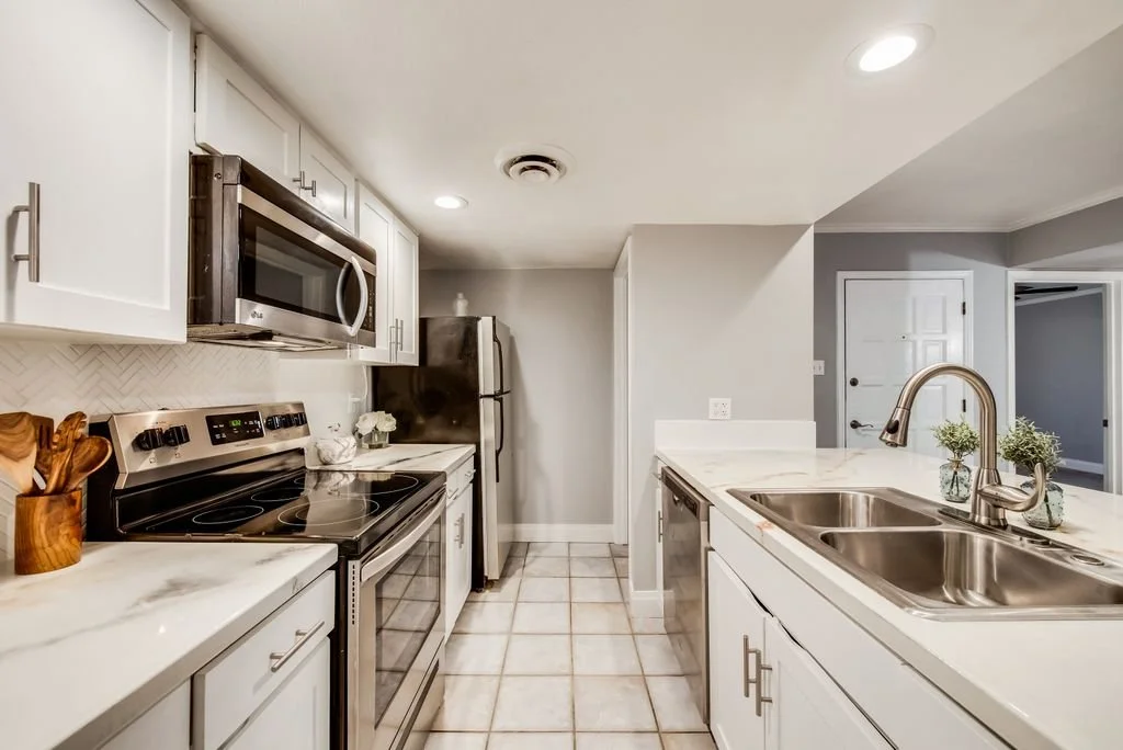 Kitchen: A refined color palette designed to elevate the existing lighting and flooring for a cohesive, modern aesthetic