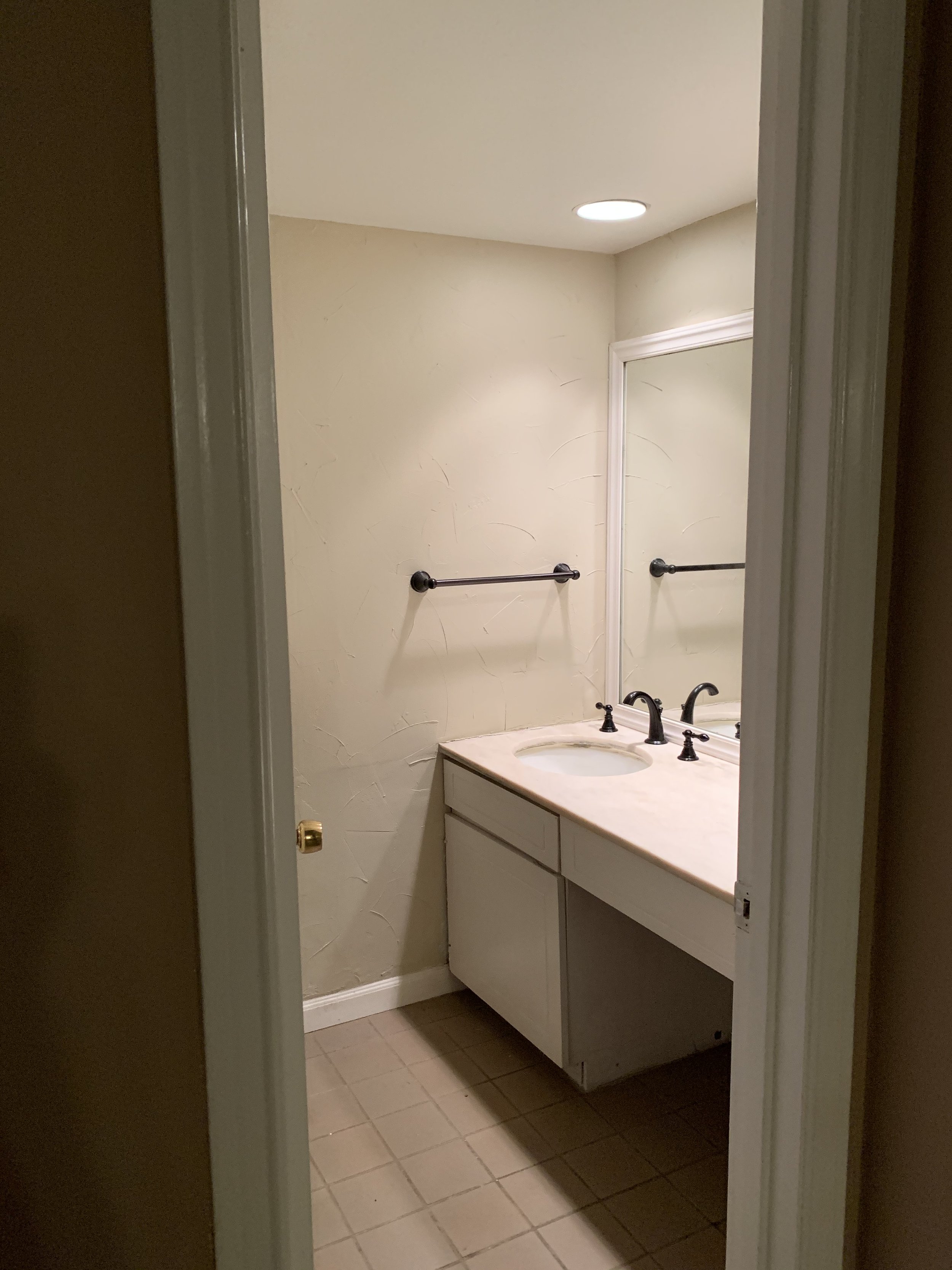 Half Bathroom: Original fixtures and dated finishes (Before)