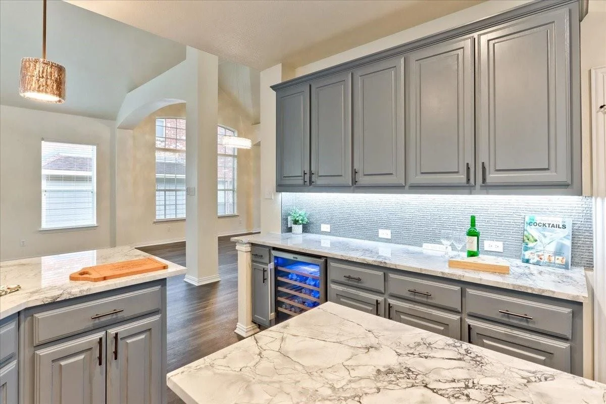 Kitchen: Premium countertops, backsplash, and updated cabinetry designed to bring excitement to the culinary experience