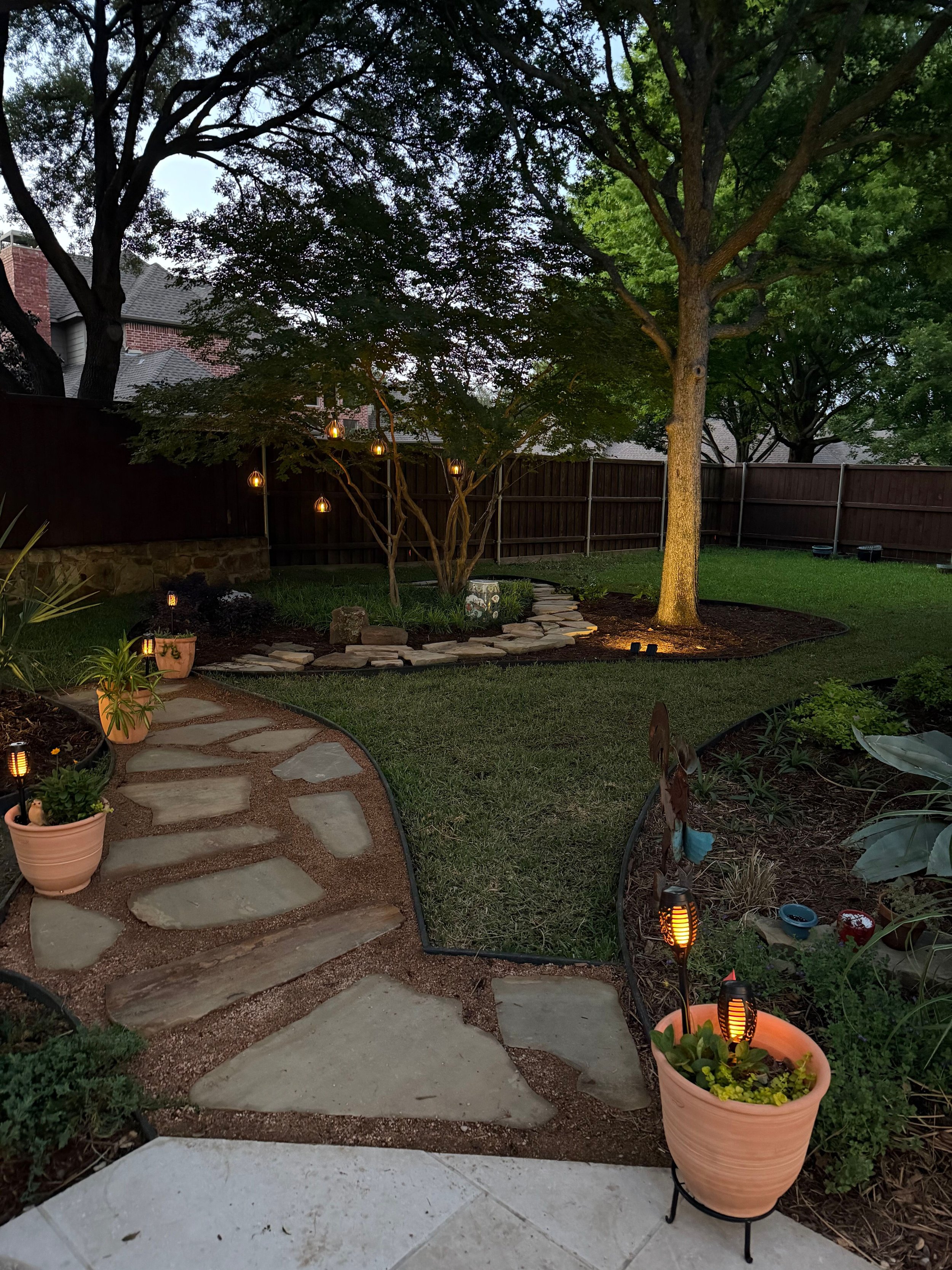 Landscape: Elegant LED lighting provided by Client enhances the landscape design in the evening.