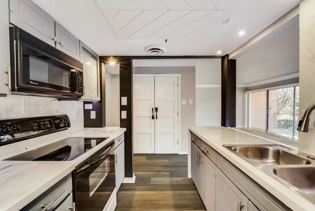 Kitchen: Modernized entry featuring custom chalkboard walls to create a playful, interactive transition into the space