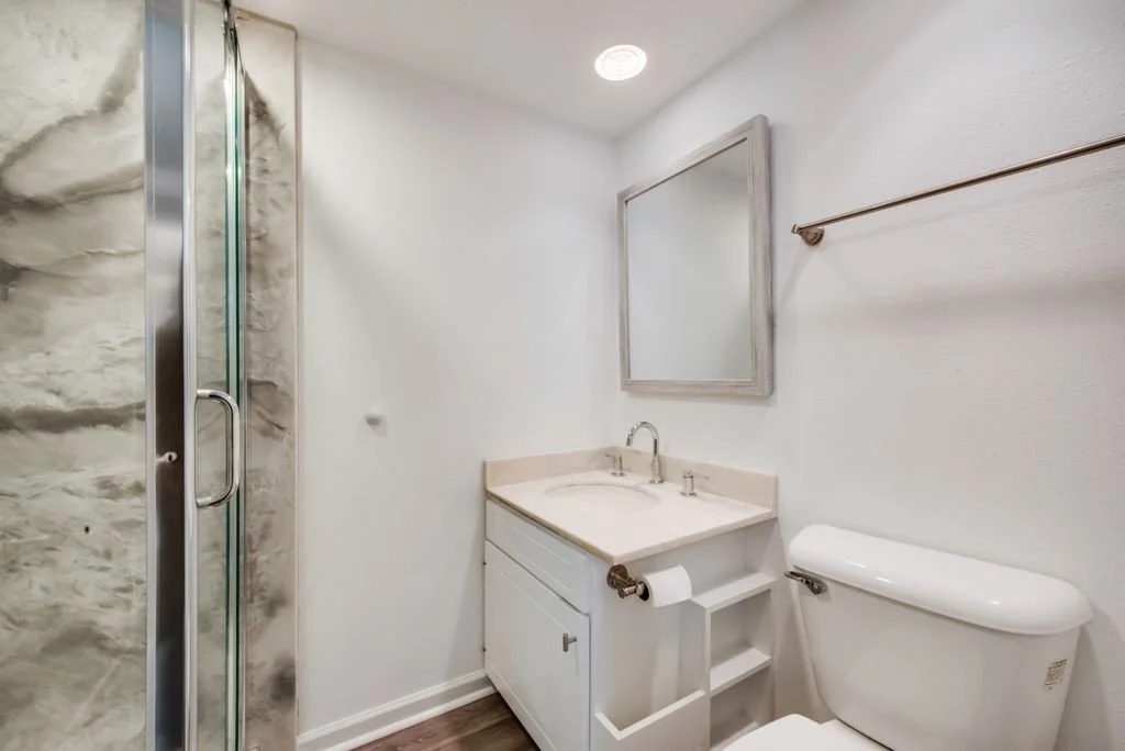 Half Bathroom: Converted into full bathroom with custom vanity, epoxy shower walls, and updated layout
