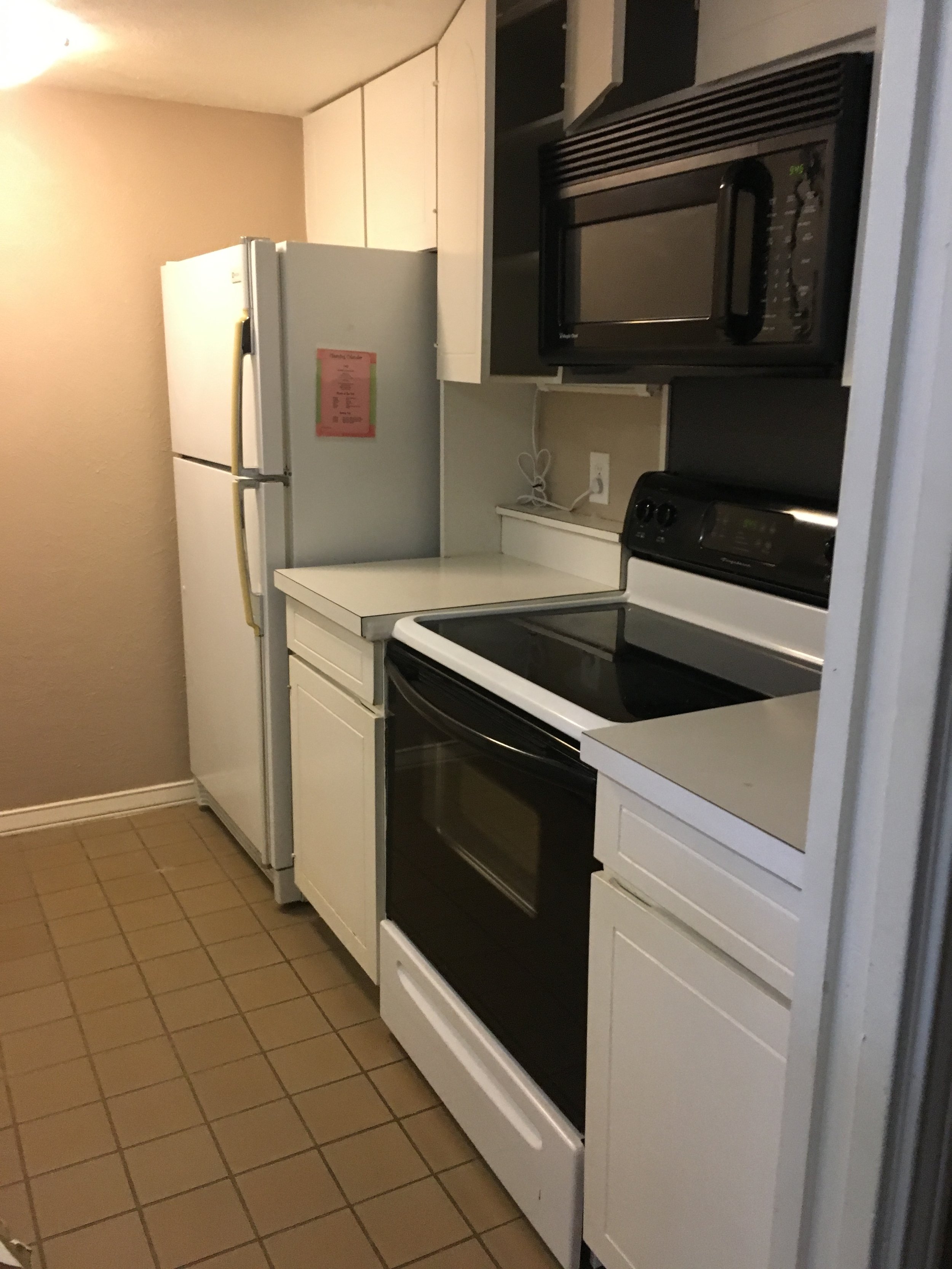 Kitchen: Poor lighting constrained the visual space (Before)