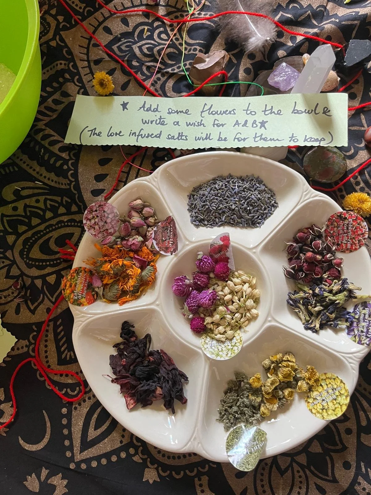 mother blessing ceremony or blessingway hosted by Your Doula Aurelia. Image shows dried herbs and flowers for making love infused salts for the mother and family to keep