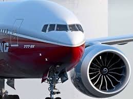 Close-up of a commercial airplane's nose and engine.
