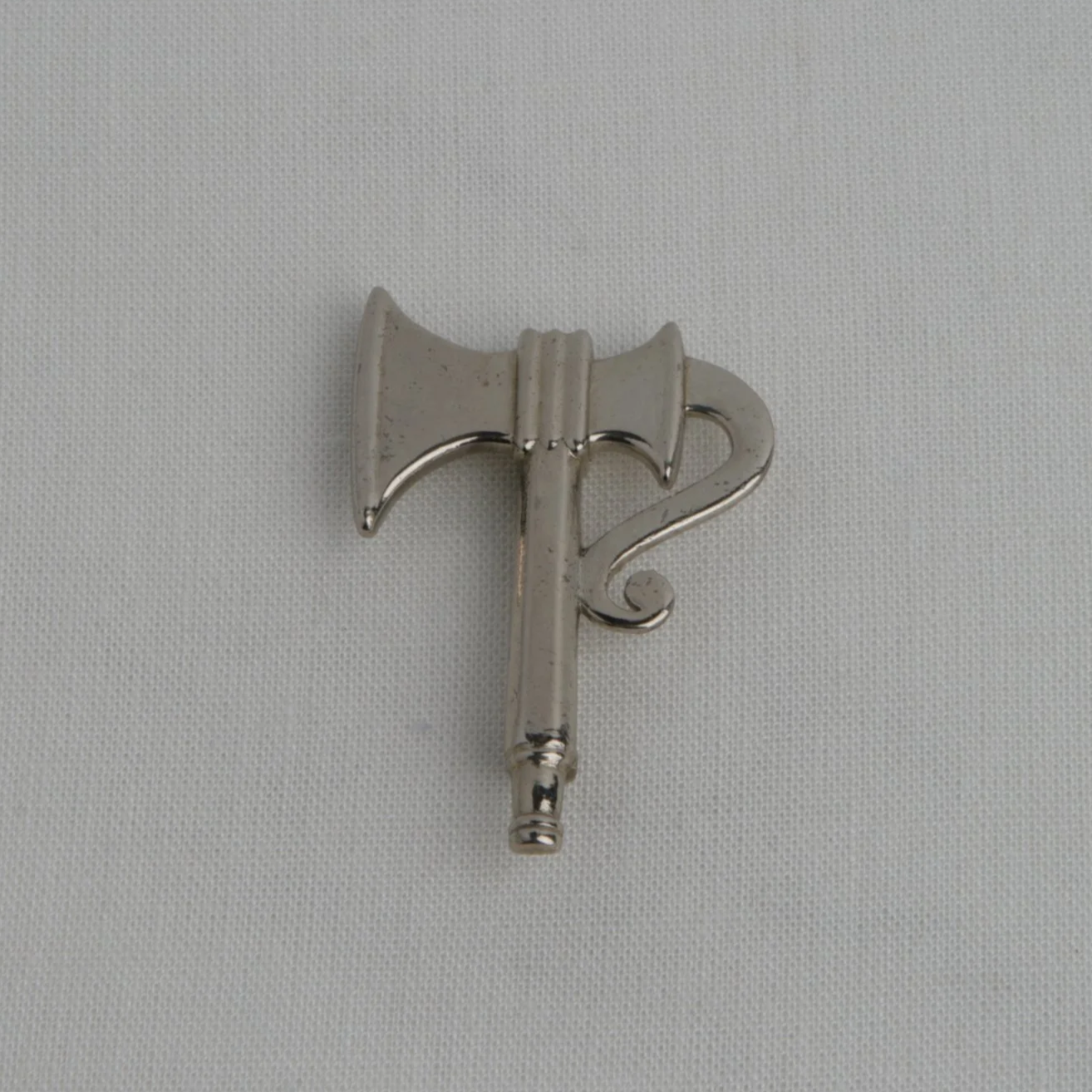 White Bronze Axe-Form Brooch