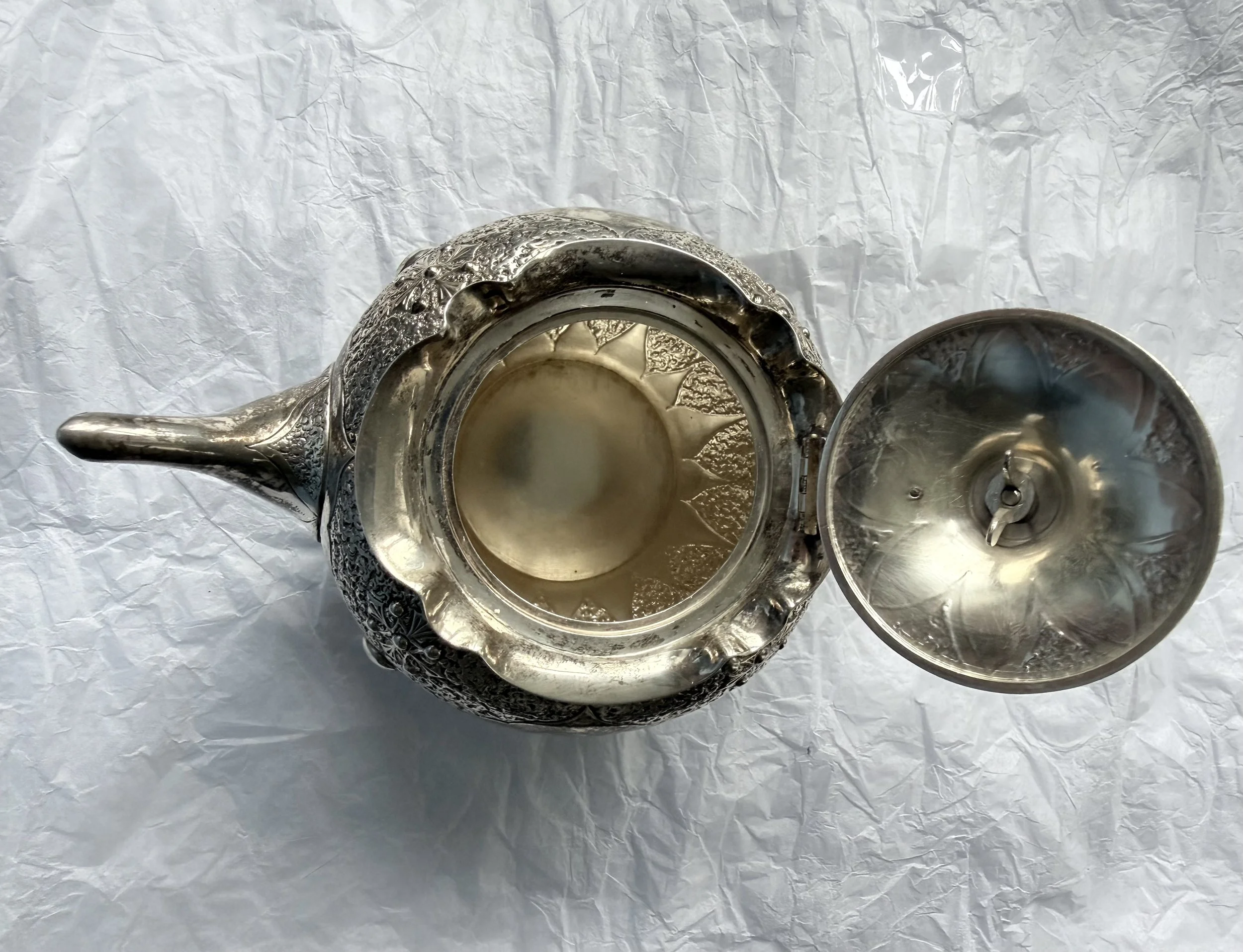 Ornate three-piece Victorian embossed silver bachelor’s tea set by Charles Edwards, London 1880.